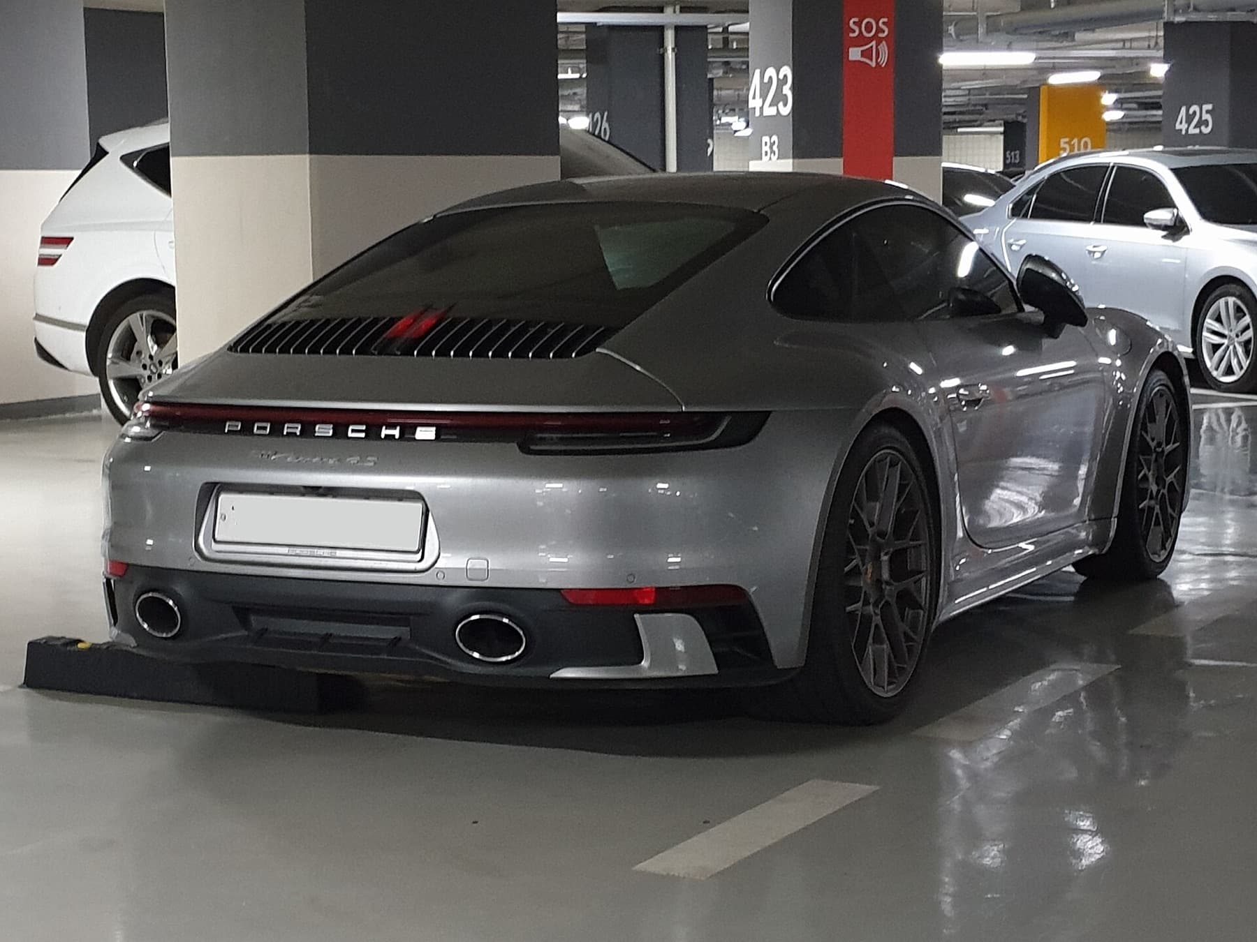 Gloss factory paint on the 911 before satin PPF.