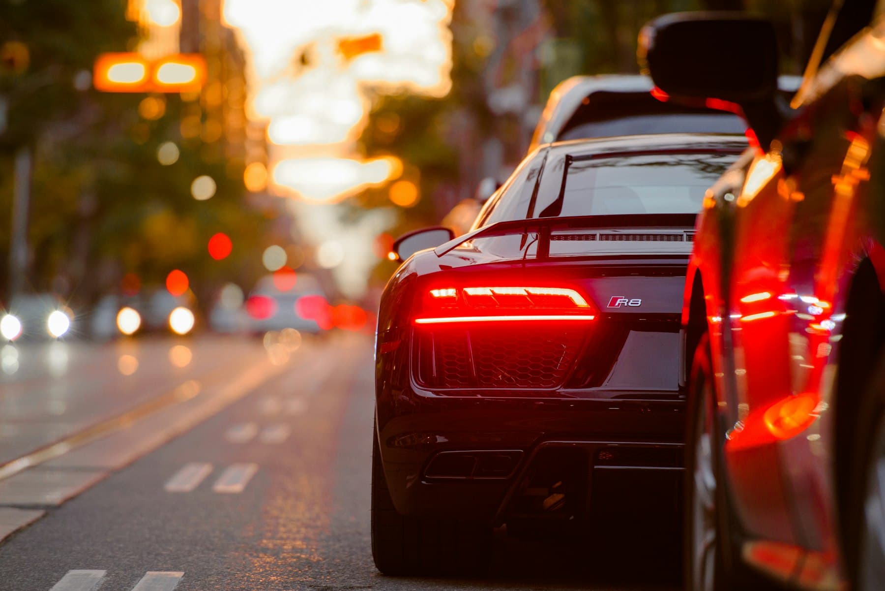 Dark-tinted rear glass of a coupé in studio light.